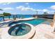 Beautiful swimming pool and hot tub overlooking the bay and dock, creating a serene outdoor experience at 290 N Washington Dr, Sarasota, FL 34236