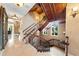 Elegant staircase with dark wood banister, decorative ironwork, and marble floors throughout at 290 N Washington Dr, Sarasota, FL 34236