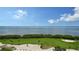 Scenic aerial view of lush golf course and bay at 3060 Grand Bay Blvd # 182, Longboat Key, FL 34228