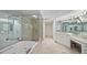 Spa-like bathroom with soaking tub, walk-in shower, and vanity at 3060 Grand Bay Blvd # 182, Longboat Key, FL 34228