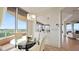 Bright breakfast nook with a glass table, comfortable seating, and panoramic views of the golf course at 3060 Grand Bay Blvd # 182, Longboat Key, FL 34228