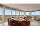 Elegant dining area with modern lighting, beautiful golf course views, and an open layout at 3060 Grand Bay Blvd # 182, Longboat Key, FL 34228