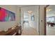 Inviting foyer with an elegant console table, art, and entry to the living spaces with ocean views at 3060 Grand Bay Blvd # 182, Longboat Key, FL 34228