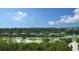 Scenic view of the lush golf course, beautiful landscaping, and serene lake within the community at 3060 Grand Bay Blvd # 182, Longboat Key, FL 34228