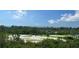 Expansive golf course view with lush greenery, sand traps, and distant ocean views, highlighting the landscape at 3060 Grand Bay Blvd # 182, Longboat Key, FL 34228