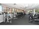 Fitness center with modern equipment, large windows, and views of the surrounding buildings and landscape at 3060 Grand Bay Blvd # 182, Longboat Key, FL 34228
