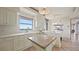 Gourmet kitchen featuring custom island, and bright breakfast area at 3060 Grand Bay Blvd # 182, Longboat Key, FL 34228
