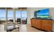 Bright living room with water views, balcony access, and modern decor at 3060 Grand Bay Blvd # 182, Longboat Key, FL 34228