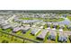 Aerial shot of a neighborhood featuring cozy homes, scenic ponds, and manicured landscaping at 3108 Rock Sound St, Bradenton, FL 34208