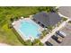 Aerial view of the pool and community center with adjacent parking, and carefully landscaped grounds at 3108 Rock Sound St, Bradenton, FL 34208