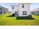 Backyard features a lush lawn and patio area with seating at 3108 Rock Sound St, Bradenton, FL 34208