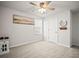 Bedroom with neutral carpet, a ceiling fan, a window, and closet door at 3108 Rock Sound St, Bradenton, FL 34208