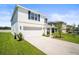 Charming two story home with two car garage and driveway and manicured lawn at 3108 Rock Sound St, Bradenton, FL 34208