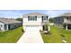 Charming two-story home with a well-manicured lawn and inviting front entrance at 3108 Rock Sound St, Bradenton, FL 34208