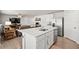 Bright, open kitchen with stainless steel appliances and views to living area at 3108 Rock Sound St, Bradenton, FL 34208