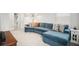 Spacious living room featuring a comfortable blue sectional sofa and stylish decor at 3108 Rock Sound St, Bradenton, FL 34208