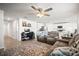 Open-concept living room featuring plush seating and a seamless flow to the kitchen at 3108 Rock Sound St, Bradenton, FL 34208