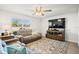 Inviting living room with comfortable seating and a large window at 3108 Rock Sound St, Bradenton, FL 34208
