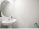 Stylish powder room with pedestal sink and modern fixtures at 3108 Rock Sound St, Bradenton, FL 34208