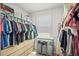 Walk-in closet with custom built in shelving, hanging racks, and storage bins at 3108 Rock Sound St, Bradenton, FL 34208