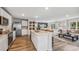 Modern kitchen with a center island, stainless steel appliances, and an open layout into the living area at 3210 Bitterroot Ln, Lakewood Ranch, FL 34211