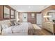 Charming main bedroom with an ensuite bathroom, decorative art, and a comfortable layout with soft lighting at 3210 Bitterroot Ln, Lakewood Ranch, FL 34211