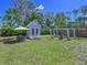 Backyard with shed, dining set, and fire pit at 3212 Avenue A W, Bradenton, FL 34205
