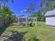 Large backyard with fire pit, seating area, and a storage shed at 3212 Avenue A W, Bradenton, FL 34205