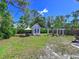 Spacious backyard with a shed, fire pit, and patio furniture at 3212 Avenue A W, Bradenton, FL 34205