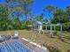 Spacious backyard featuring a fire pit area, shed and deck at 3212 Avenue A W, Bradenton, FL 34205