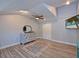 Charming bedroom featuring wood-look floors, neutral walls, and a decorative dresser with a mirror at 3212 Avenue A W, Bradenton, FL 34205