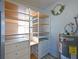 Organized walk-in closet with shelving and storage solutions and water heater at 3212 Avenue A W, Bradenton, FL 34205