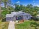 Charming single-story home with inviting front porch and well-kept lawn and landscape at 3212 Avenue A W, Bradenton, FL 34205