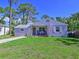 Inviting home with a cozy porch and manicured front yard at 3212 Avenue A W, Bradenton, FL 34205