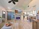 Bright living room with fireplace, modern furniture, an open layout, and seamless flow to the kitchen at 3212 Avenue A W, Bradenton, FL 34205