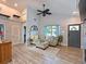 Inviting living room with vaulted ceilings, ceiling fan, and comfortable seating area at 3212 Avenue A W, Bradenton, FL 34205