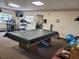 Game room featuring a pool table, fitness equipment, and sitting area at 3212 Oakwood S Blvd, Sarasota, FL 34237