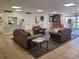 Inviting lobby featuring comfortable leather seating and a decorative area rug at 3212 Oakwood S Blvd, Sarasota, FL 34237