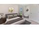 Cozy bedroom with a view, complemented by modern furnishings and stylish decor at 3214 Bitterroot Ln, Lakewood Ranch, FL 34211