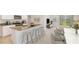 Open-concept kitchen featuring granite countertops, a breakfast bar, and seamless flow to the living area at 3214 Bitterroot Ln, Lakewood Ranch, FL 34211