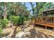 Backyard features a wooden deck with access to the screened in porch and yard at 3934 Brookside Dr, Sarasota, FL 34231