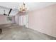 Bright bedroom with beamed ceilings, chandelier and a view to the entryway at 3934 Brookside Dr, Sarasota, FL 34231