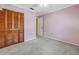 Bedroom features include neutral carpet and a closet with bi-fold doors at 3934 Brookside Dr, Sarasota, FL 34231