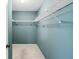 A closet with a light blue wall, carpeted floors and shelving at 3934 Brookside Dr, Sarasota, FL 34231