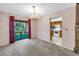 Dining area with chandelier and sliding glass doors, open to the kitchen at 3934 Brookside Dr, Sarasota, FL 34231