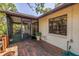 Wooden deck with a screened in porch and lush, tropical backyard setting at 3934 Brookside Dr, Sarasota, FL 34231