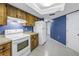 Bright kitchen with white appliances and wooden cabinetry at 3934 Brookside Dr, Sarasota, FL 34231