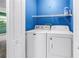 A look into a laundry room with a white washer and dryer set at 3934 Brookside Dr, Sarasota, FL 34231