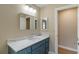 Bathroom featuring vanity with marble countertop and views to other rooms at 4443 Robin Hood W Trl, Sarasota, FL 34232