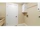 Functional laundry room with sink, cabinet, and washer/dryer hookups at 4443 Robin Hood W Trl, Sarasota, FL 34232